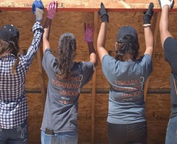 CIP scholars building a house